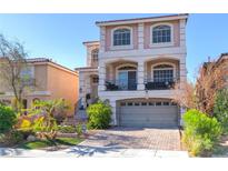 Charming two-story home with a brick driveway, covered balcony, and well-maintained landscaping at 6714 Flamenco Ct, Las Vegas, NV 89139