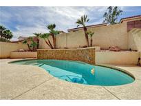 Inviting pool featuring a charming tile water feature and easy access from the home at 7637 Good Fortune Ct, Las Vegas, NV 89139