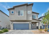 Charming two-story home with a two-car garage and well-maintained landscaping at 9876 Magnus Ct, Las Vegas, NV 89178