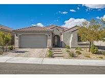 Charming single story home with a tile roof, low maintenance yard and a two car garage at 10456 Skye Arroyo Ave, Las Vegas, NV 89166