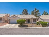 Charming single-story home with a two-car garage, desert landscaping and a tile roof at 169 Alterra Dr, Henderson, NV 89074