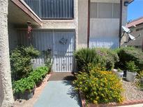 Charming condo with a quaint front entrance, beautiful flowers and a secure gated entry at 1748 Jupiter Ct # C, Las Vegas, NV 89119