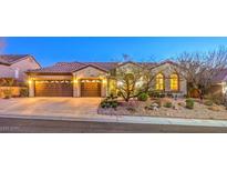 Charming single-story home featuring a well-manicured front yard and an attached two-car garage at 1809 Prichard Ave, Henderson, NV 89052