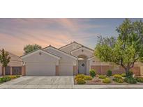 Charming single-story home with a three-car garage, well-maintained landscaping, and inviting curb appeal at 2025 Dakota Lodge Ave, Las Vegas, NV 89123