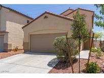 Charming home featuring a two-car garage, neutral tones, and low-maintenance landscaping at 3037 Austin Pale Ave, North Las Vegas, NV 89081
