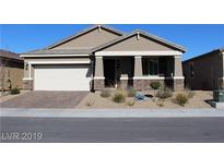 Charming single-story home with a low-maintenance desert-style landscaped front yard and attached two-car garage at 4108 Fairywren Dr, North Las Vegas, NV 89031