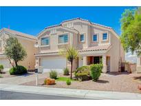 Charming two-story home featuring a well-manicured front yard and a two car garage at 412 Orchid Oasis Ave, North Las Vegas, NV 89031