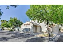 View of the community's exterior including the clubhouse, sidewalks, and landscaping with a community sign reading 'Park Village' at 4770 Topaz St # 113, Las Vegas, NV 89121