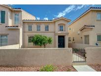 Inviting two-story home features a secure front yard, desert landscaping, and a cozy entrance at 56 Belle Ridge Ave, Las Vegas, NV 89123