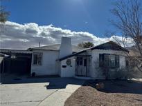 Charming home with a unique chimney design and a well-maintained front yard on a sunny day at 621 S 9Th St, Las Vegas, NV 89101