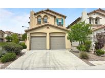 Charming two-story home featuring a two-car garage, desert landscaping, and a tile roof at 7815 Shingle Beach St, Las Vegas, NV 89166
