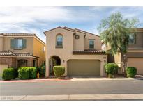 Charming two-story home featuring a cozy front porch and two-car garage at 10229 Mayflower Bay Ave, Las Vegas, NV 89166