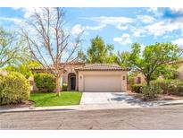 Charming single-story home featuring a well-maintained front yard and two-car garage at 10505 Jeremy Ridge Ave, Las Vegas, NV 89144