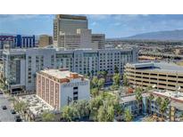Bright city view of buildings, hotels, and cityscape with blue sky and scenic mountain range in the background at 150 Las Vegas Blvd # 1503, Las Vegas, NV 89101