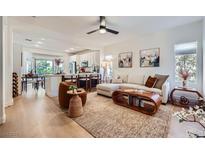 Bright, open living room flows into the kitchen and dining area, creating a welcoming and airy space at 2107 Desert Woods Dr, Henderson, NV 89012