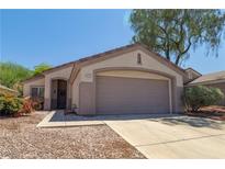 Charming single-story home with a two-car garage and desert landscaping at 2173 Point Mallard Dr, Henderson, NV 89012