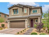 Beautiful two-story home with a well-manicured lawn and attached two-car garage at 2711 Evolutionary Ln, Las Vegas, NV 89138