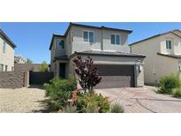 Charming two-story home featuring a two-car garage and well-maintained landscaping at 2924 Sunday Silence Rd, North Las Vegas, NV 89086