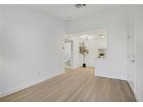 Bright living room boasts sleek, light wood floors and neutral walls, creating an airy and inviting space at 5171 Lindell Rd # 201, Las Vegas, NV 89118