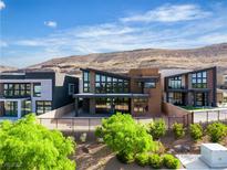 Stunning modern home featuring unique architectural details and lush landscaping at 5364 Succulent Rose Dr, Las Vegas, NV 89135