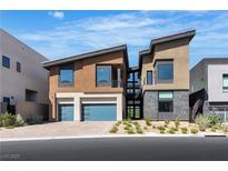 Modern two-story home with a two-car garage and contemporary architectural design at 5364 Succulent Rose Dr, Las Vegas, NV 89135
