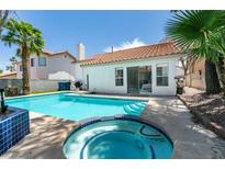 Inviting backyard features a sparkling pool and spa, perfect for outdoor entertaining at 8640 Trafalgar Dr, Las Vegas, NV 89117