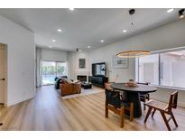 Bright living room boasts recessed lighting, fireplace, and sliding glass doors to the outdoor pool area at 8640 Trafalgar Dr, Las Vegas, NV 89117