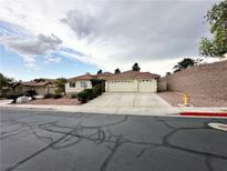 Charming single-story home featuring a three-car garage and well-maintained front yard at 1006 Winding Hill St, Henderson, NV 89002