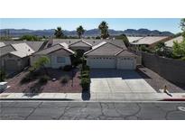 Charming single-story home featuring a well-maintained yard and a three-car garage at 1006 Winding Hill St, Henderson, NV 89002