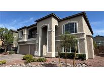 Stunning two-story home with a landscaped front yard and a two-car garage at 10066 Golden Bluff Ave, Las Vegas, NV 89148