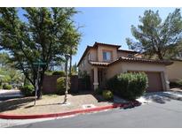 Charming two-story home with a tile roof and an attached garage in a well-maintained neighborhood at 1220 Padre Serra Ln, Las Vegas, NV 89134