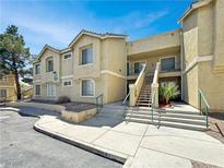 Two-story apartment building with stairs leading to the units and a well-maintained exterior at 1509 Linnbaker Ln # 102, Las Vegas, NV 89110