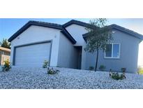 Charming single-story home with a two car garage and a low maintenance rock yard at 1905 Harvard St, North Las Vegas, NV 89030