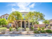 Charming two-story home featuring a well-maintained front yard and inviting entryway at 2369 Via Barranca St, Henderson, NV 89044