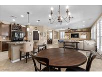 Inviting living room featuring a dining area, hardwood floors, and natural light at 465 Cabral Peak St, Las Vegas, NV 89138