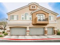 Inviting multi-level townhome featuring a private balcony and attached two-car garage at 4833 Straight Flush Dr # 103, Las Vegas, NV 89122