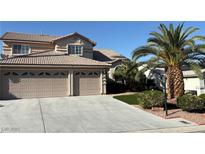 Beautiful home featuring a well-manicured lawn and an attached two car garage at 5104 Burr Oak Dr, Las Vegas, NV 89130