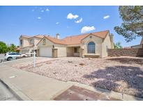 Charming single-story home featuring a well-maintained yard and a cozy, inviting facade at 610 Playa Del Sol Way, Henderson, NV 89015