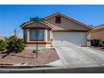Charming single-story home with a well-manicured yard and a two-car garage on a sunny day at 6520 Blooming Sun Ct, Las Vegas, NV 89142