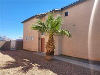 Two-story home featuring a desert landscaped yard and stucco siding in an arid climate at 7102 Shimmering Ave, Henderson, NV 89011