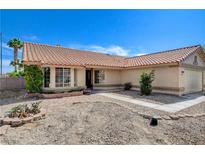 Charming single-story home featuring a red tile roof, neutral stucco, and low-maintenance desert landscaping at 7417 Radville Dr, Las Vegas, NV 89129