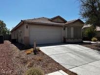 Charming single-story home with a two-car garage, low-maintenance desert landscaping, and a covered front porch at 7850 Flagler St, Las Vegas, NV 89139