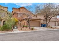 Two-story home with a two-car garage and low-maintenance landscaping in a residential neighborhood at 7937 Granite Walk Ave, Las Vegas, NV 89178