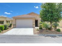 Charming single-story home featuring a two-car garage and low-maintenance desert landscaping at 2445 Sturrock Dr, Henderson, NV 89044