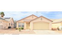 Charming single-story home featuring a two-car garage and a well-maintained xeriscaped front yard at 5112 Foggia Ave, Las Vegas, NV 89130