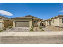 Charming single-story home featuring a well-manicured front yard and a two-car garage at 6607 Summershade St, North Las Vegas, NV 89086