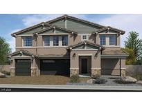 Stunning two-story home showcasing a three-car garage, stone accents and complementary color palette at 7709 Serenity Bay Ln # 56, North Las Vegas, NV 89084