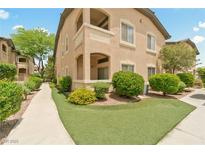 Beautiful exterior of a two-story condo featuring well-maintained landscaping at 8985 S Durango Dr # 1177, Las Vegas, NV 89113