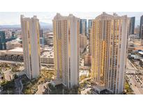 High-rise condo towers with golden windows offer stunning views of the surrounding cityscape at 125 E Harmon Ave # 2918, Las Vegas, NV 89109