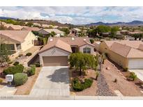 Charming single-story home featuring desert landscaping, a two-car garage, and tile roofing at 3071 Lake Barkley Rd, Henderson, NV 89052